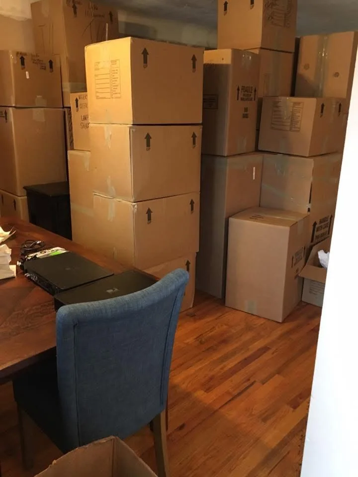 Moving boxes stacked in the kitchen of Steve and CJ's first Michigan home
