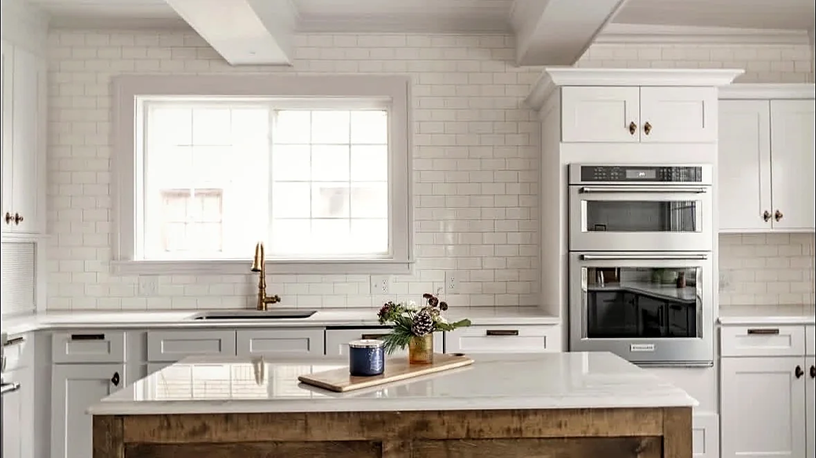 Finished kitchen with island and double ovens