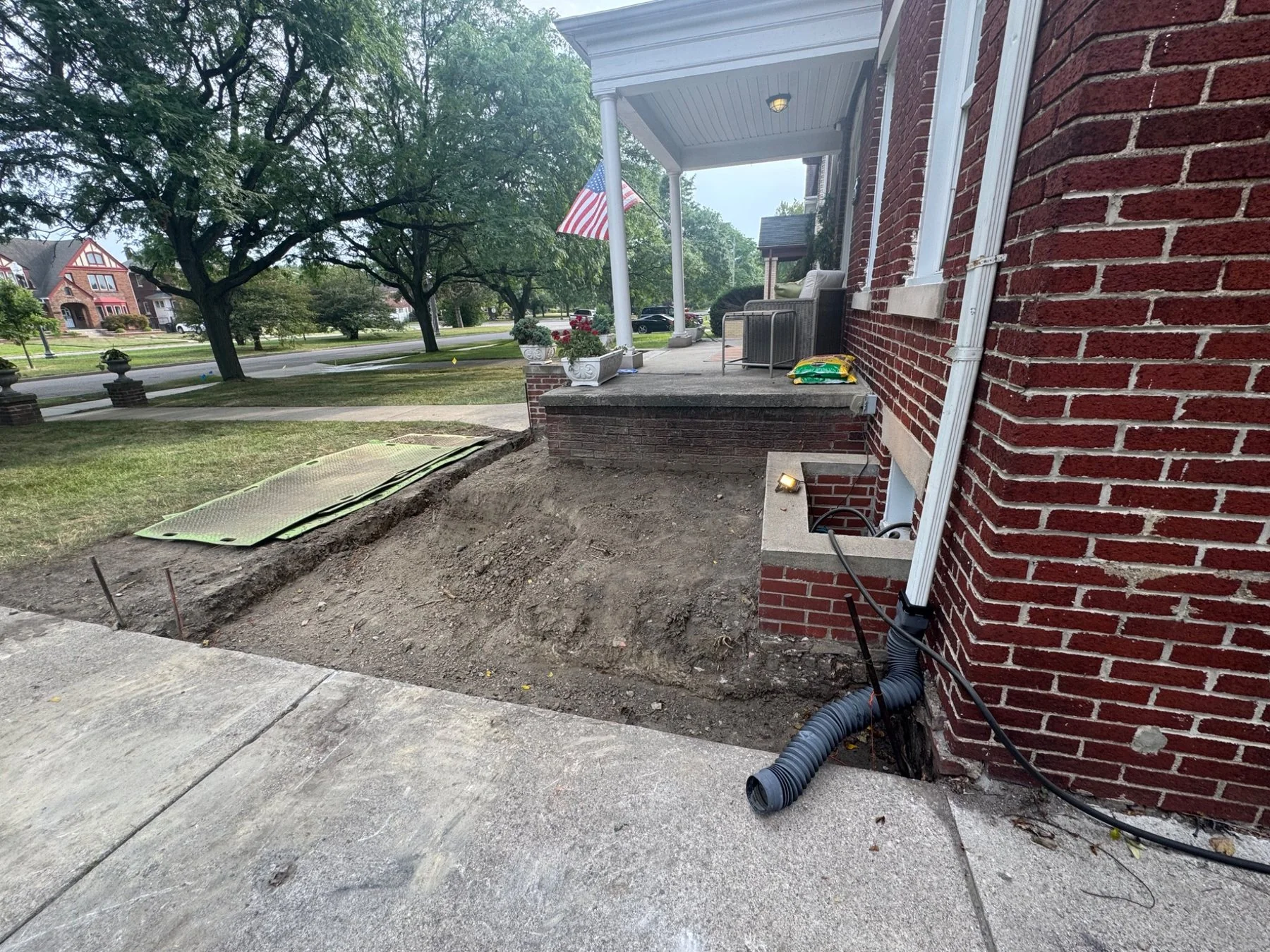 Front planting beds excavated beside the porch