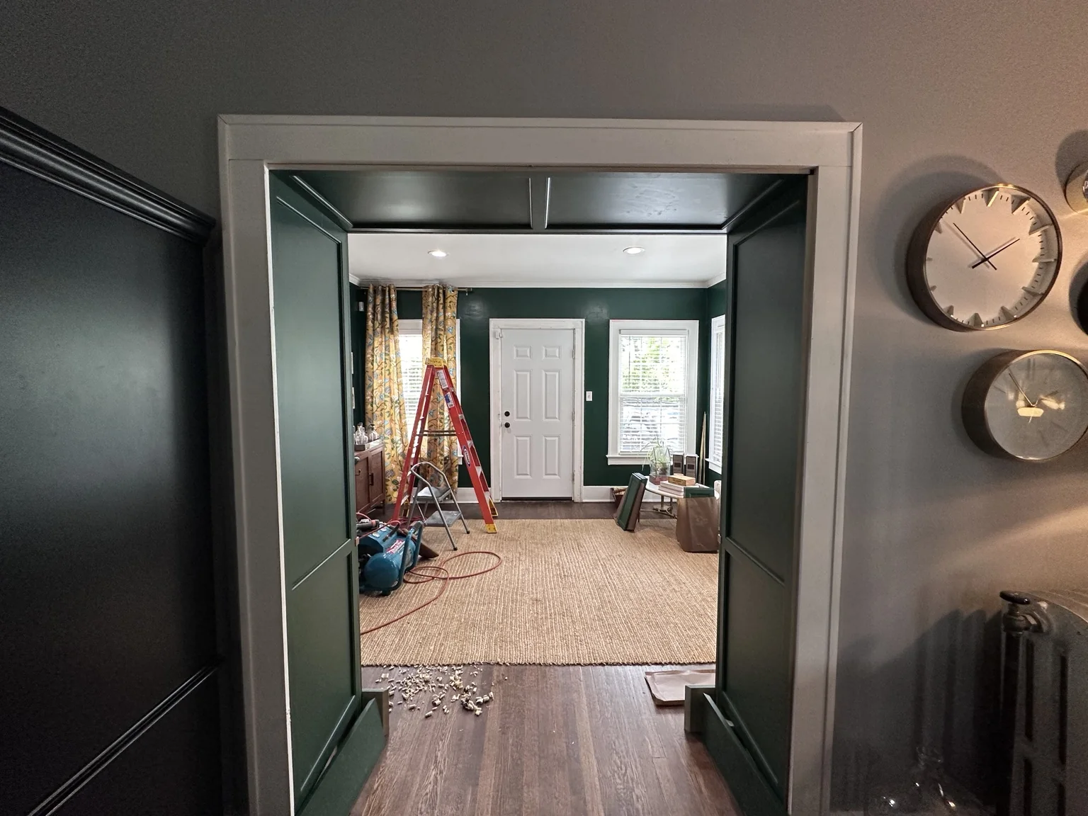 View from the living room back through the newly paneled library passage during installation