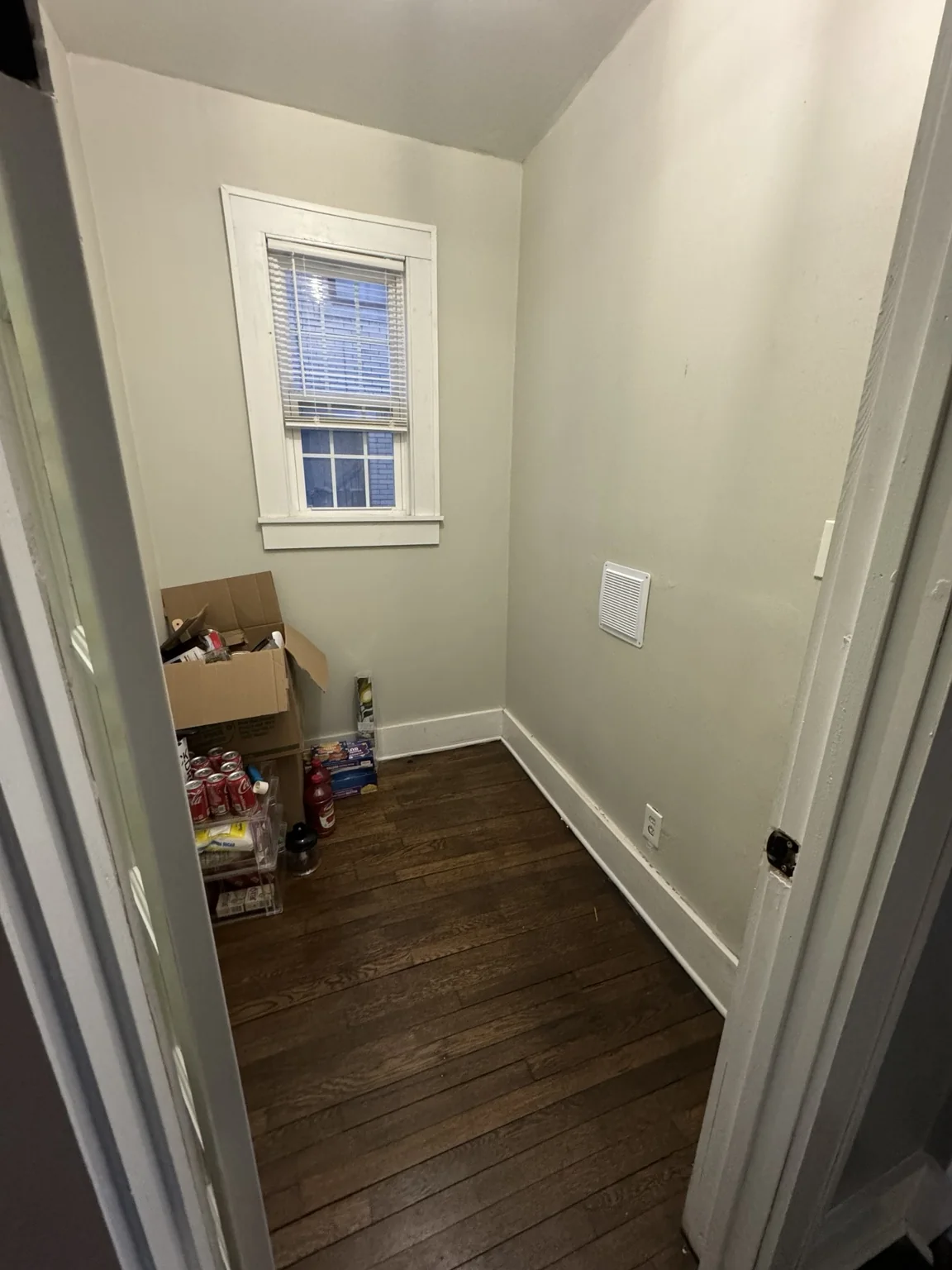 Small room between the dining room and kitchen after the washer and dryer were moved to the basement