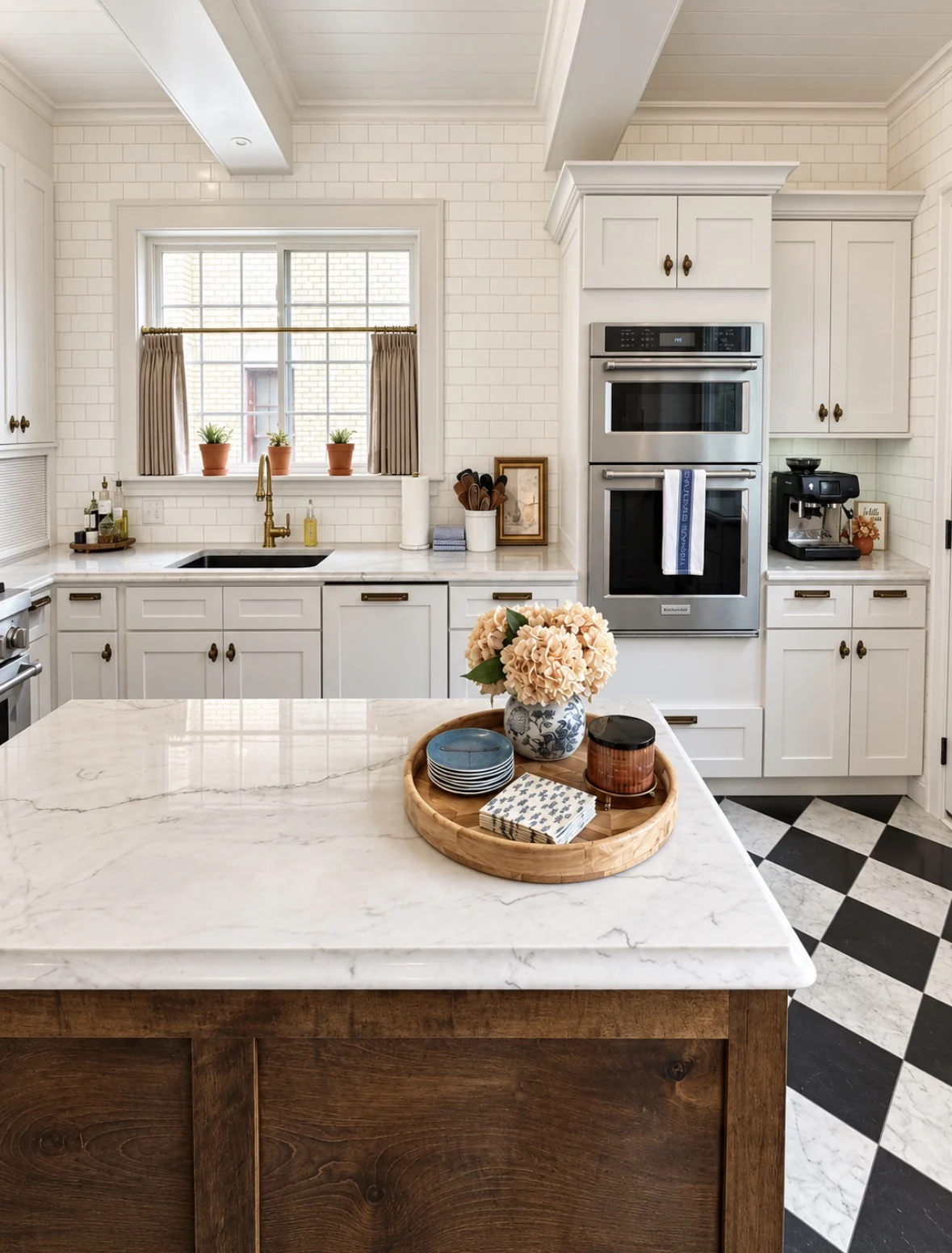 Kitchen island styled with hydrangeas, tray, and subtle seasonal details